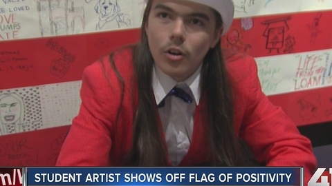 Student artist shows off flag of positivity