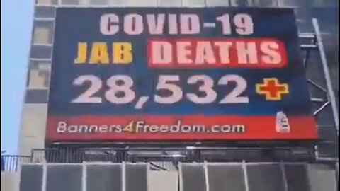 In New York City, Times Square. Covid -19 jab deaths.