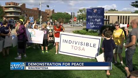 Hundreds come out in Tosa with message of peace