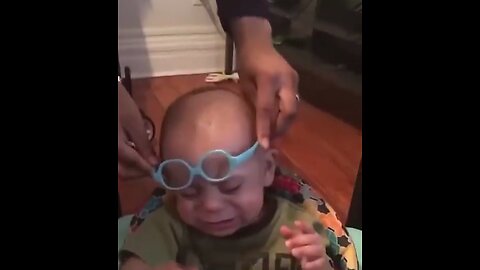 The reaction of the baby who wears glasses and starts to see clearly for the first time.