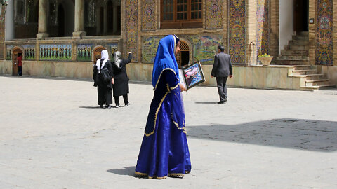 A queen in blue dress in Palace