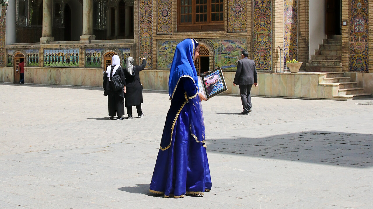 A queen in blue dress in Palace