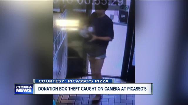 Woman caught on camera stealing donation box from pizzeria