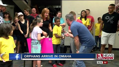 Orphans arrive in Omaha