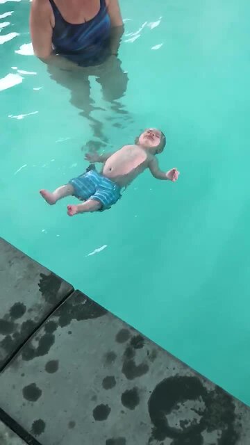 5-Month-Old Knows How To Roll Onto Back In Water