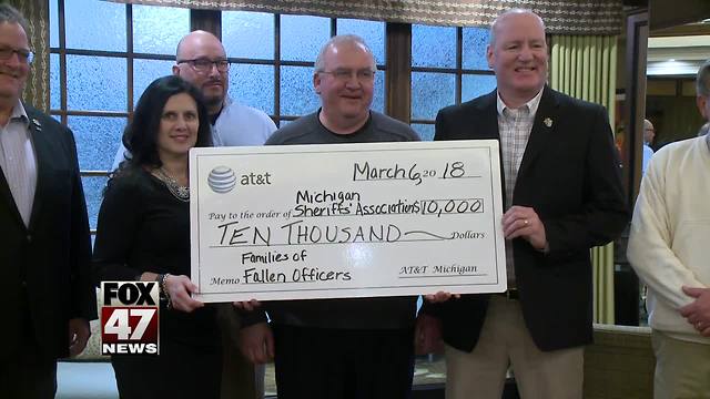 AT&T makes donation to help families of Michigan's fallen officers