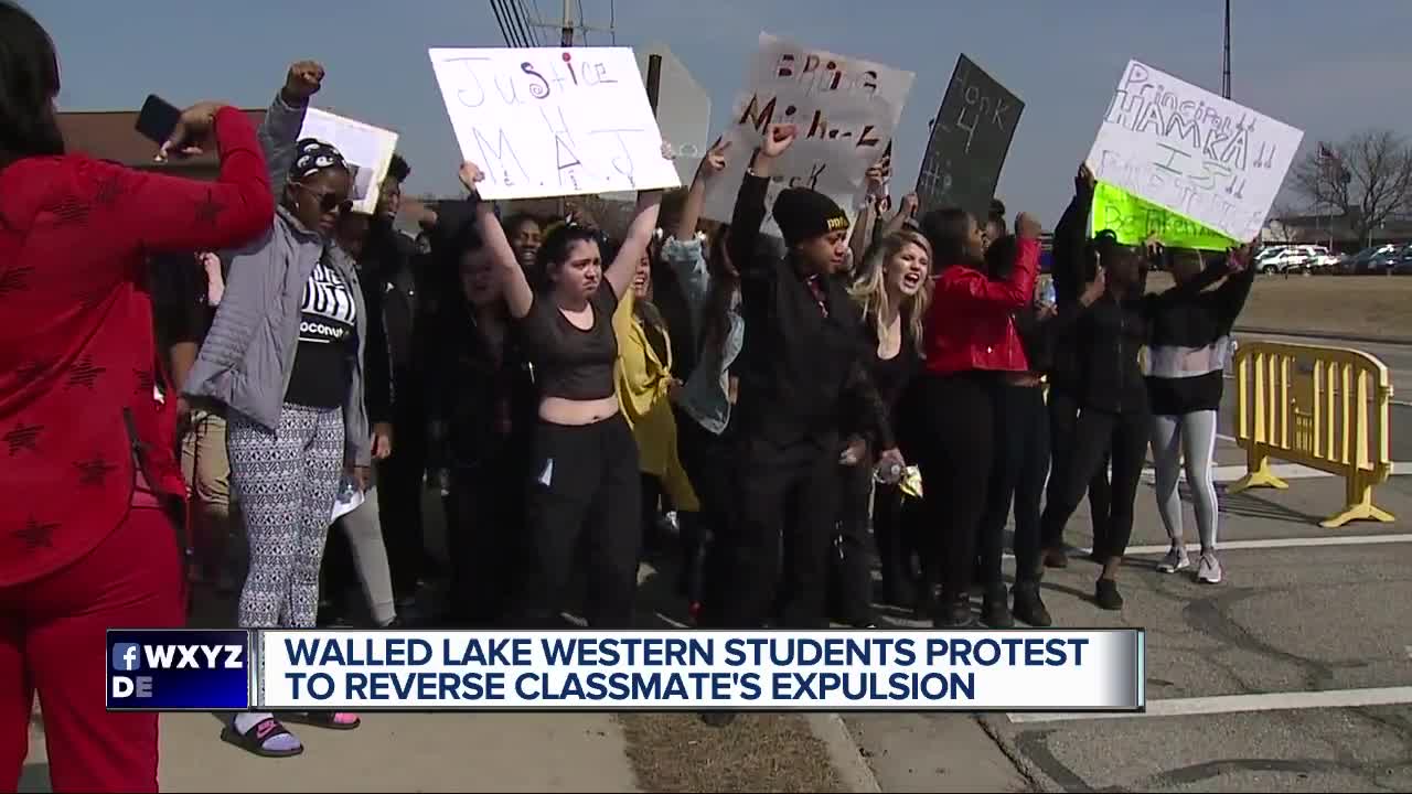 Students hold walkout protest after Walled Lake school banned teen who was shot