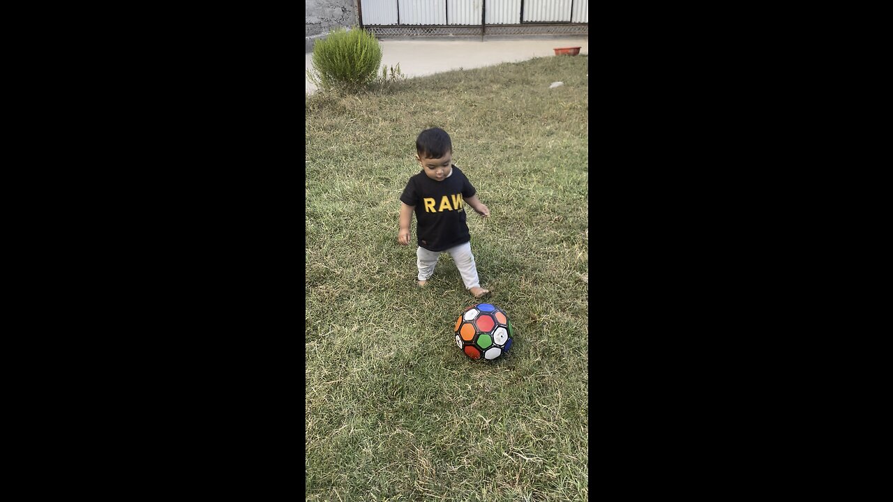 Playing football child