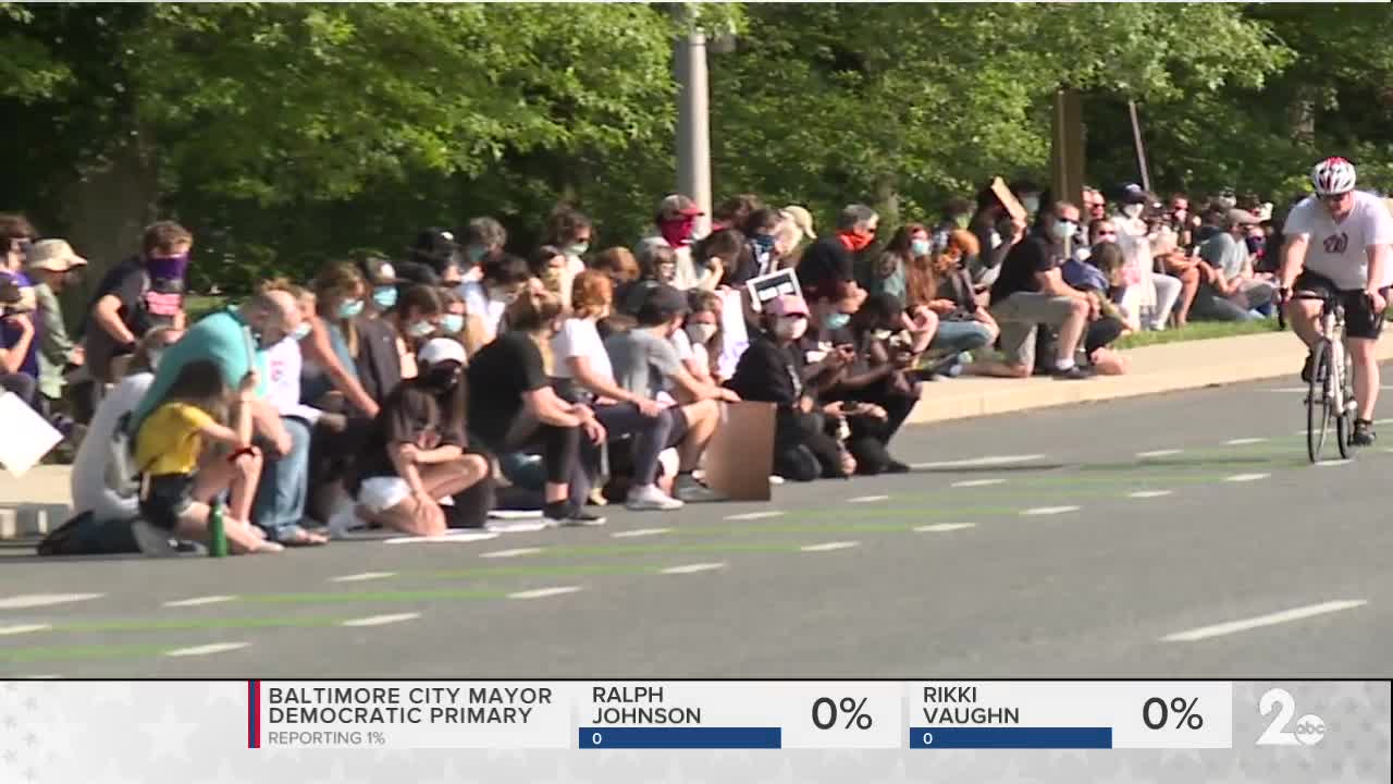 A community comes together in Roland Park to form a peaceful protest