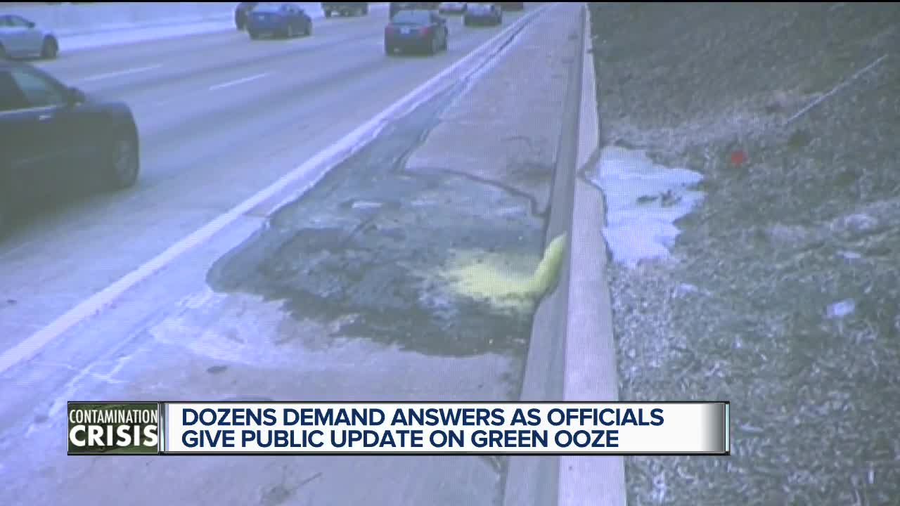 Dozens demand answers as officials give public update on green ooze
