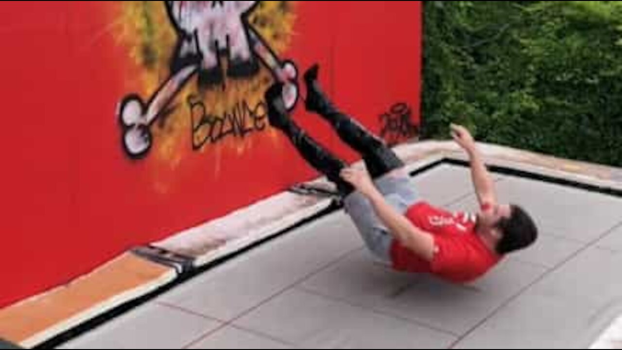 Man jumps on trampoline wearing high heels