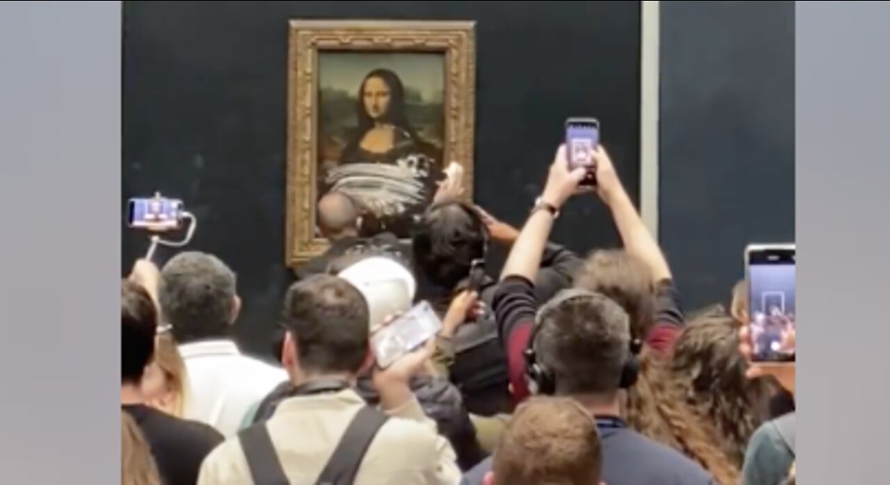 Man Dressed as Woman Defiles Mona Lisa With Cake While Yelling About Climate Change