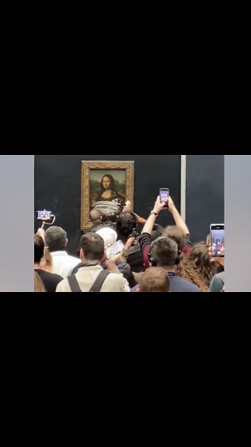 Man Dressed as Woman Defiles Mona Lisa With Cake While Yelling About Climate Change