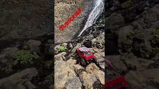 SCX 24 crawling on a water fall