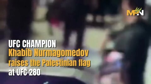 Former UFC champion Khabib Nurmagomedov raises the Palestinian flag last night at UFC 280