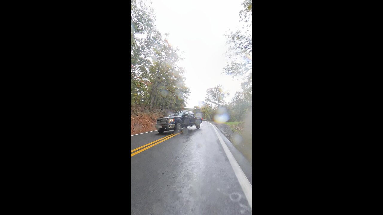 Truck pulls out in front of motorcyclist in the rain