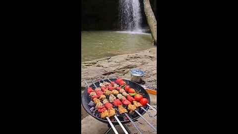 Eating grilled chicken by the river