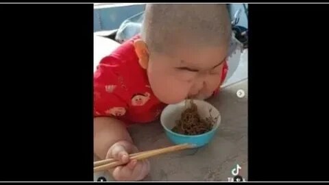 KID EATING NOODLES