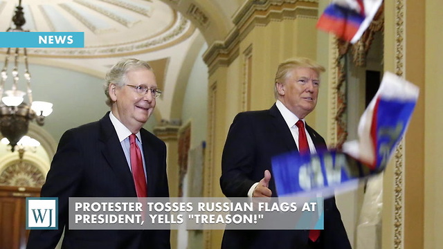 Protester Tosses Russian Flag at President, Yells "Treason!"