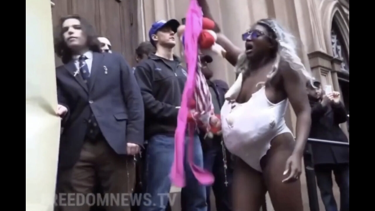 Roe v Wade: Protesting Woman Pretends to Kill Babies & Says “God Murdered His Son, Why Can’t I” in Front of a NY Catholic Church