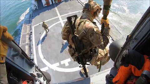 Coast Guard Maritime Security Response Team members conduct fast rope demonstration