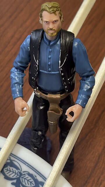 Chop Sticks are a challenge for a tiny Cowboy