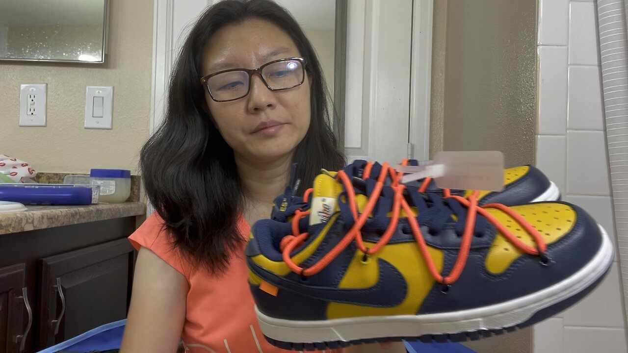 This is a pair Fake Nike dunk university gold midnight navy shoes