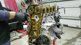 Timing chain replacement and head stud install Honda k20 engine