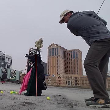 Man Hits Golf Ball Into Camera