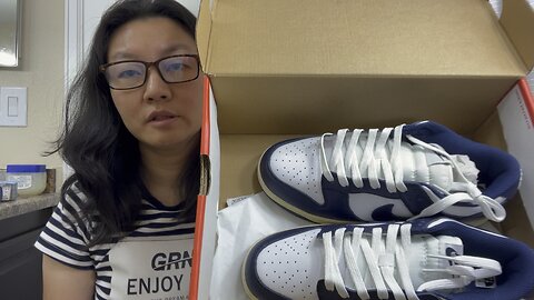 This is a pair FAKE Nike dunk white midnight navy shoes