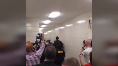 Jason Brown walks to 1st court appearance on charges he shot, killed Southport police officer