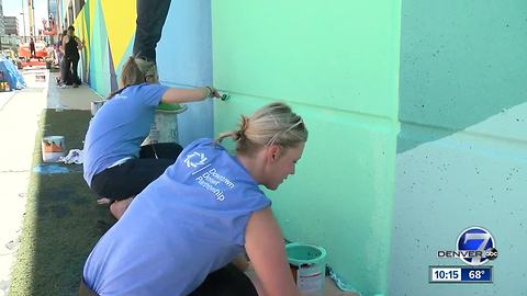 Artists paint parking garage to show its vibrant way of life