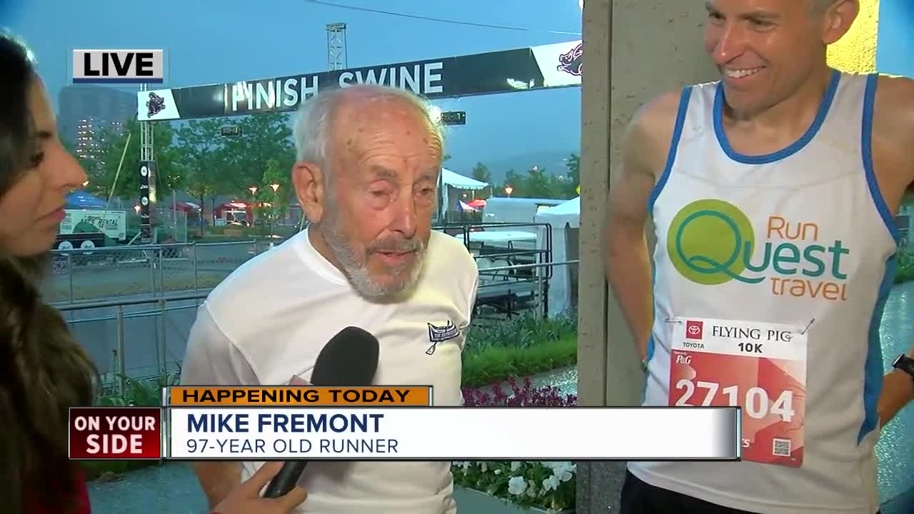 Runners Mike Fremont and Harvey Lewis prepare for the Flying Pig Toyota 10K