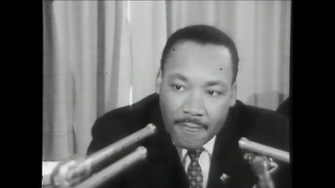 Martin Luther King Jr. speaks at a news conference at the Milwaukee Auditorium