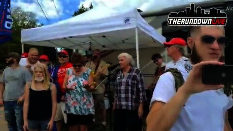 Bizarre Group Outside of Trump Rally Sings Blood on Your Hands