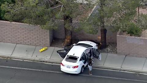 Car with multiple bullet holes crashes into wall