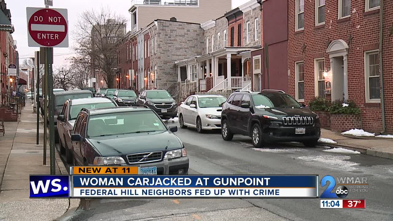 Woman carjacked at gunpoint in Federal Hill