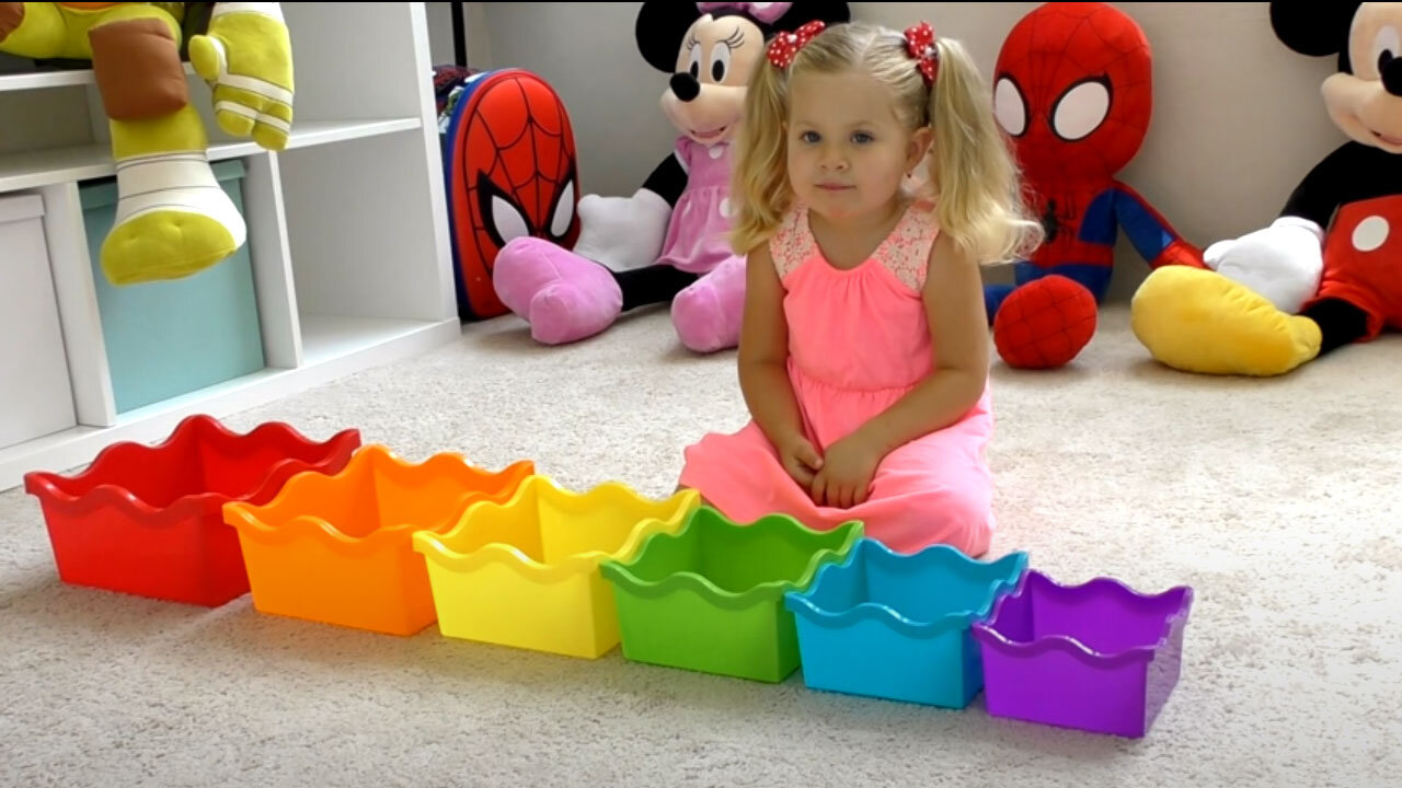 Diana plays with colored toy Pyramid