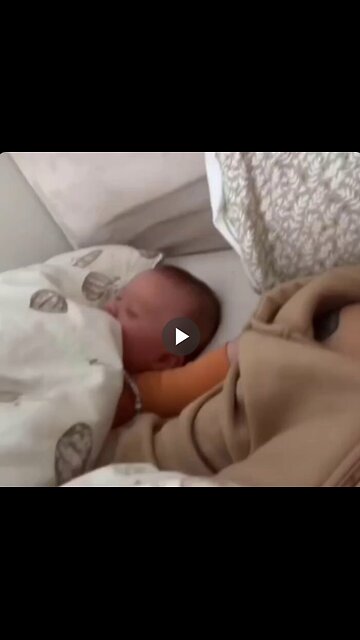 Baby laughing in its sleep.