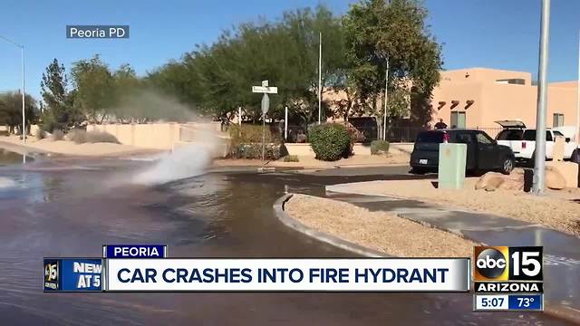 Car crashes into fire hydrant in Peoria