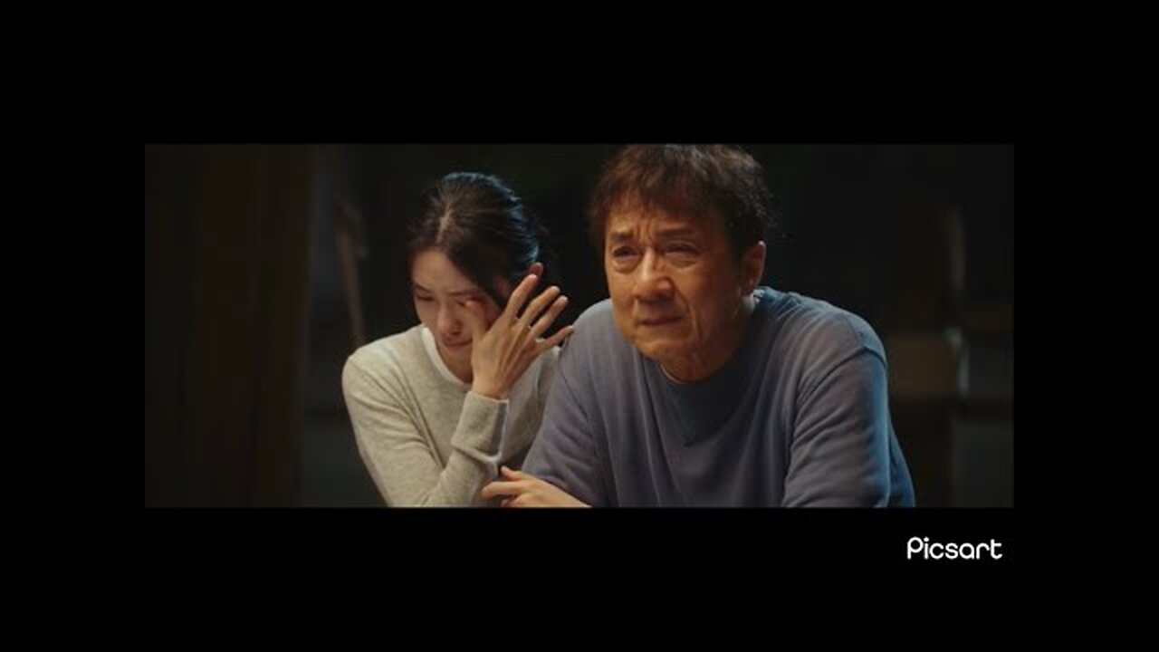 Jackie Chan crying while watching his old stunts with his daughter