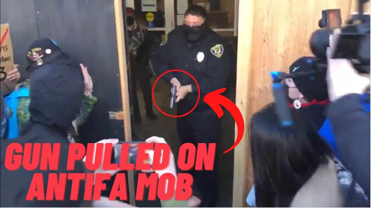 Security Draws Gun When Antifa Mob Try To Break Into Bank!