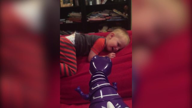 Adorable Tot Boy Afraid To Touch The Dinosaur Toy