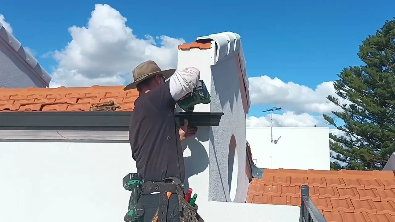 extending gutter to divert excess water off a balcony.