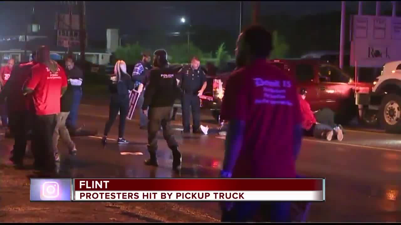 Vehicle plows into crowd of demonstrators during fast food worker strike in Flint