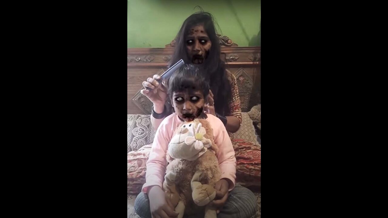 Scary girl combs her sister's hair