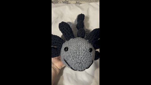 Grey crochet axolotl.