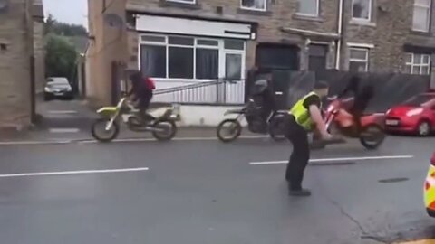 British Cop Tries To Stop A Bunch Of Punks On Motorbikes, Ends Up Getting Hit By A Quad