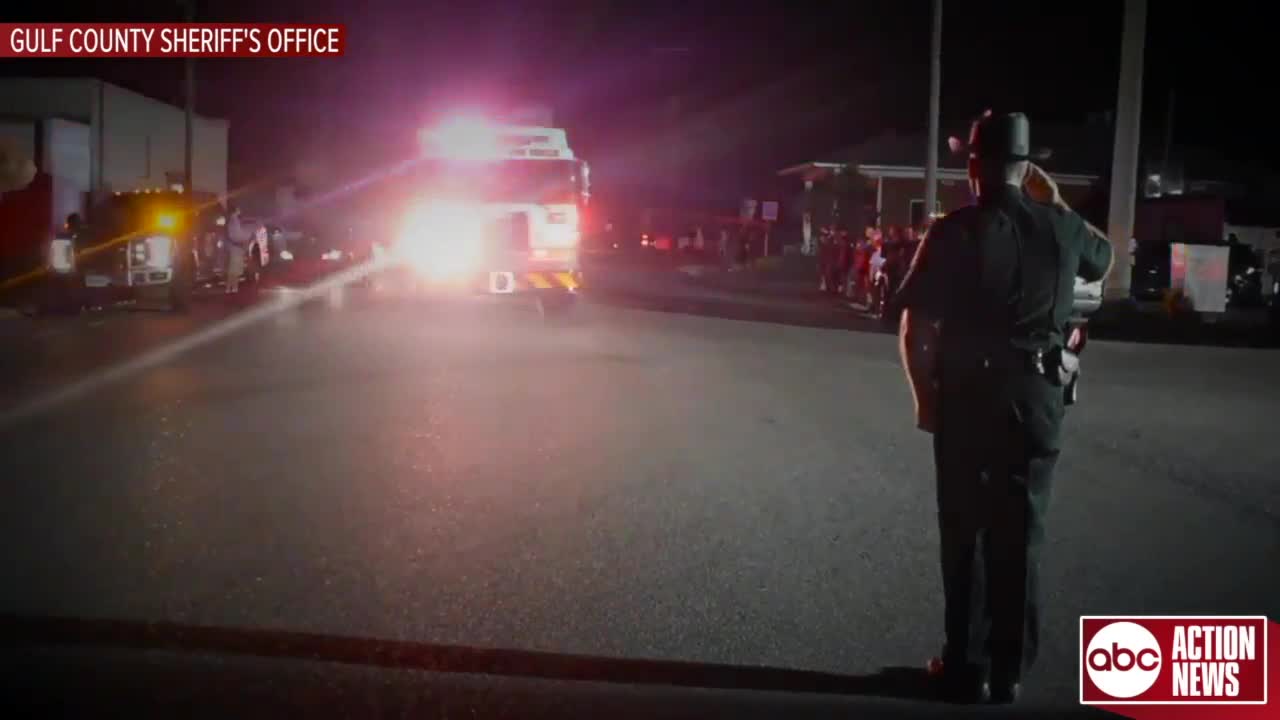 Law enforcement stands to salute Florida firefighter killed while removing debris from Hurricane Michael