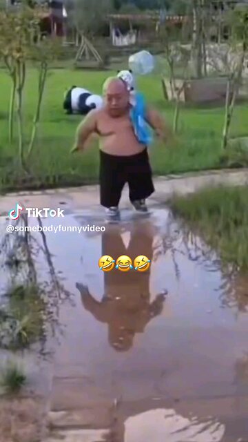 Title: "The Mighty Midget March" VD (Visual Description): A diminutive man struts down